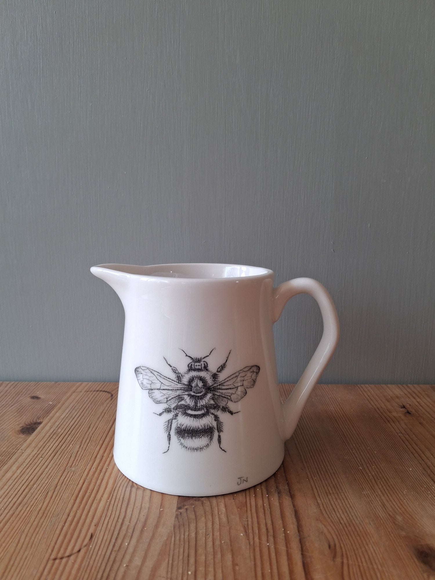 Collection of ceramic tableware featuring original hand drawn images of insects and/or botanicals