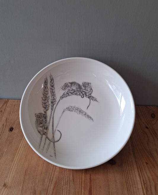 White ceramic bowl with a hand drawn image of harvest mice on wheat stalks.
