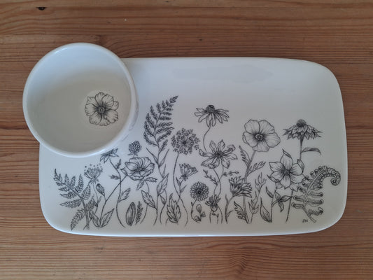 Rectangular ceramic serving platter with a matching round dipping bowl. Both items featuring hand drawn illustrations of flowers